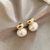 Boucles d'oreilles à perle nacrée en acier doré